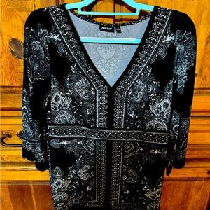 Black blouse with white accents. Very comfortable.